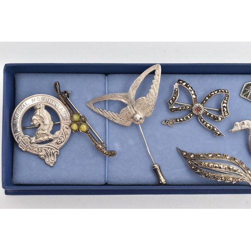 53 - A SELECTION OF SILVER AND WHITE METAL JEWELLERY, to include mainly brooches, two designed as birds, ... 