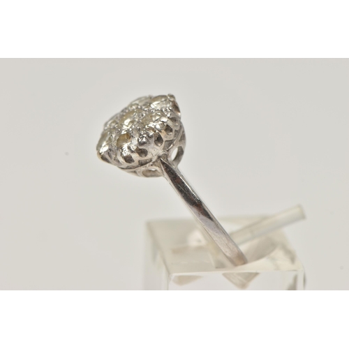 6 - AN 18CT WHITE GOLD DIAMOND CLUSTER RING, set with seven round brilliant cut diamonds, estimated tota... 