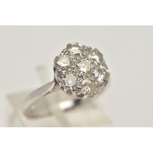 6 - AN 18CT WHITE GOLD DIAMOND CLUSTER RING, set with seven round brilliant cut diamonds, estimated tota... 