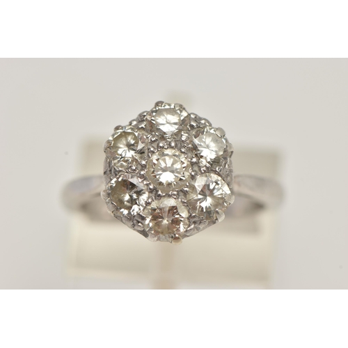 6 - AN 18CT WHITE GOLD DIAMOND CLUSTER RING, set with seven round brilliant cut diamonds, estimated tota... 