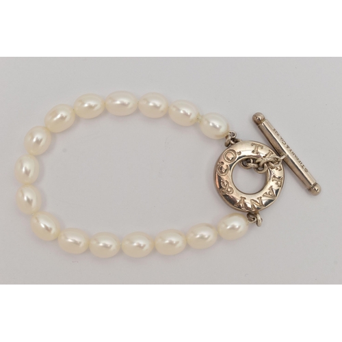 64 - A 'TIFFANY & CO' FRESH WATER PEARL TOGGLE BRACELET, a string of sixteen oval cultured fresh water pe... 