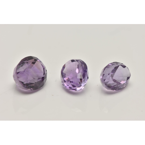 74 - THREE LOOSE OVAL CUT AMETHYSTS, largest stone measures approximately 12mm length x 9.5mm width,