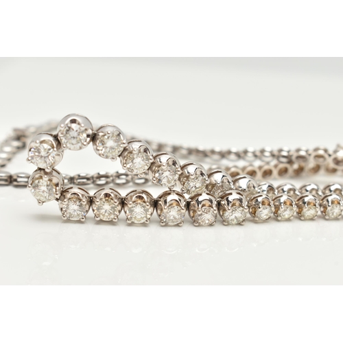 9 - A DIAMOND LINE NECKLACE, designed as a row of graduated claw set, round brilliant cut diamonds, esti... 