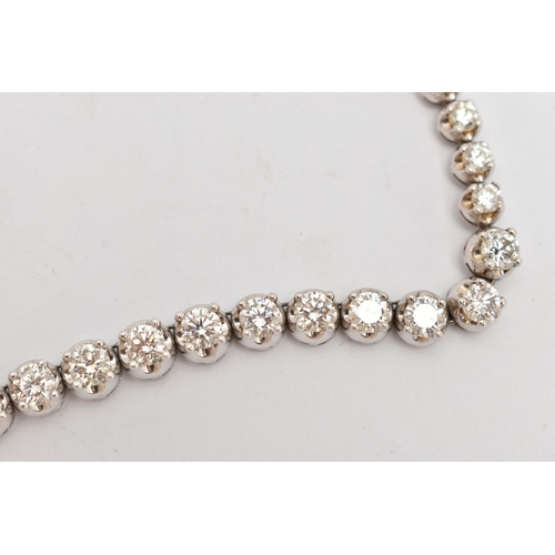 9 - A DIAMOND LINE NECKLACE, designed as a row of graduated claw set, round brilliant cut diamonds, esti... 