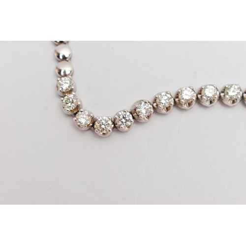 9 - A DIAMOND LINE NECKLACE, designed as a row of graduated claw set, round brilliant cut diamonds, esti... 