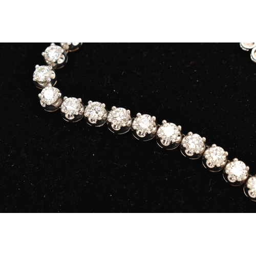 9 - A DIAMOND LINE NECKLACE, designed as a row of graduated claw set, round brilliant cut diamonds, esti... 