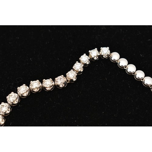 9 - A DIAMOND LINE NECKLACE, designed as a row of graduated claw set, round brilliant cut diamonds, esti... 