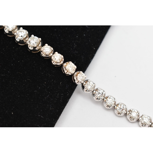 9 - A DIAMOND LINE NECKLACE, designed as a row of graduated claw set, round brilliant cut diamonds, esti... 