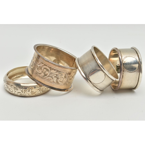 103 - FOUR SILVER NAPKIN RINGS, non-matching, various patterns, each with a full silver hallmark for Chest... 