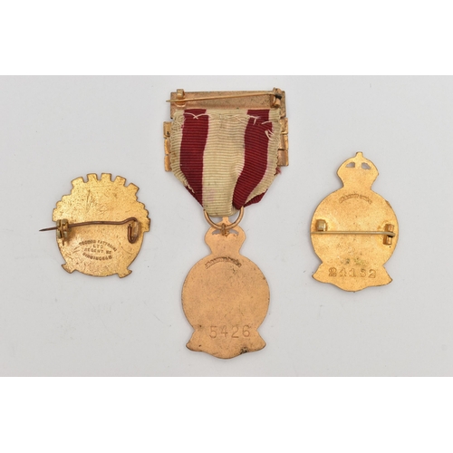 106 - AN ENAMEL RED CROSS BROOCH AND A FOB MEDAL, the medal fitted with a ribbon, together with a 'R.C.C.C... 