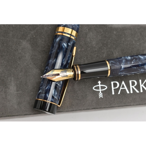 112 - A 'PARKER' FOUNTAIN PEN, blue marble with gold tone detail, nib signed 'Parker', stamped 18k, togeth... 