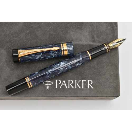 112 - A 'PARKER' FOUNTAIN PEN, blue marble with gold tone detail, nib signed 'Parker', stamped 18k, togeth... 