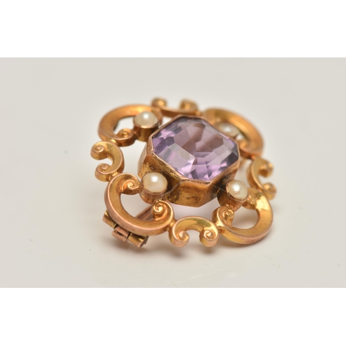 81 - A YELLOW METAL AMETHYST AND SEED PEARL BROOCH, open work scrolling brooch set with a central emerald... 