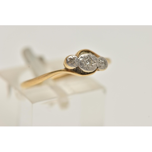 83 - A YELLOW AND WHITE METAL THREE STONE DIAMOND RING, three small single cut diamonds, star set in a wh... 