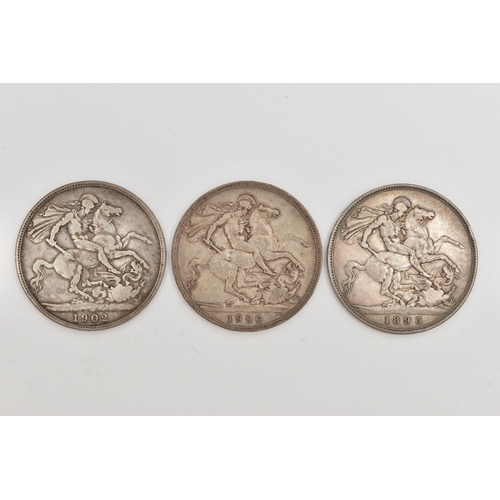 97 - THREE CROWN COINS, to include two Victorian Crowns dated 1900 and 1895, and an Edwardian Crown dated... 