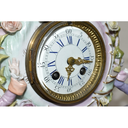 333 - TWO LATE 19TH CENTURY CONTINENTAL PORCELAIN CASED FIGURAL MANTEL CLOCKS, comprising a floral encrust... 