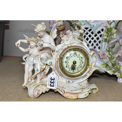 333 - TWO LATE 19TH CENTURY CONTINENTAL PORCELAIN CASED FIGURAL MANTEL CLOCKS, comprising a floral encrust... 