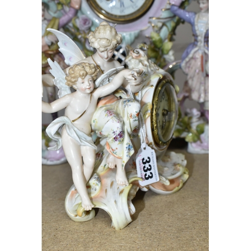 333 - TWO LATE 19TH CENTURY CONTINENTAL PORCELAIN CASED FIGURAL MANTEL CLOCKS, comprising a floral encrust... 