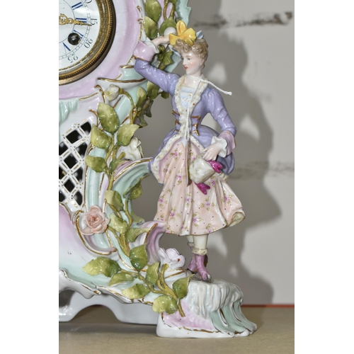 333 - TWO LATE 19TH CENTURY CONTINENTAL PORCELAIN CASED FIGURAL MANTEL CLOCKS, comprising a floral encrust... 