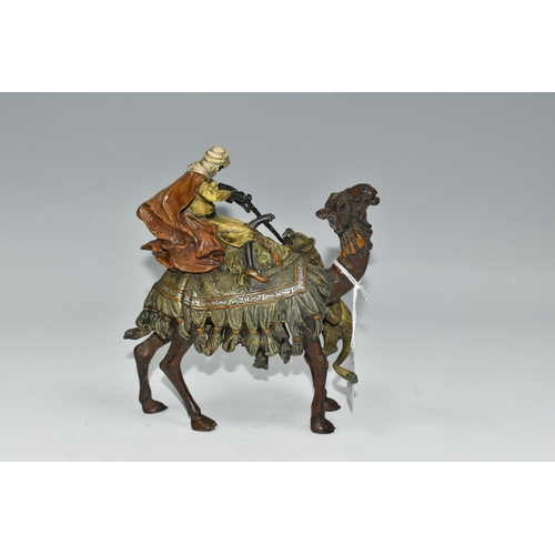 310 - A COLD PAINTED BRONZE OF AN ARAB ON A CAMEL WITH LION ATTACKING AFTER BERGMAN, unmarked, height 17cm... 