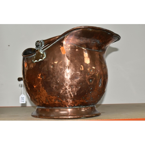 317 - A SMALL GROUP OF COPPER AND BRASSWARE, comprising a late 19th century copper 'Helmet' coal scuttle, ... 