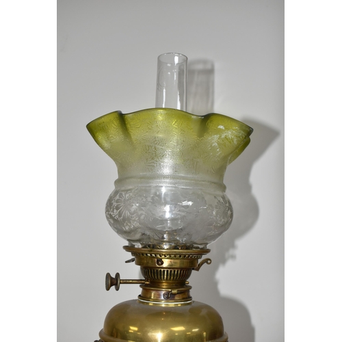 320 - AN ARTS & CRAFTS BRASS AND COPPER OIL LAMP IN THE STYLE OF W.A.S. BENSON, the frilled green and clea... 