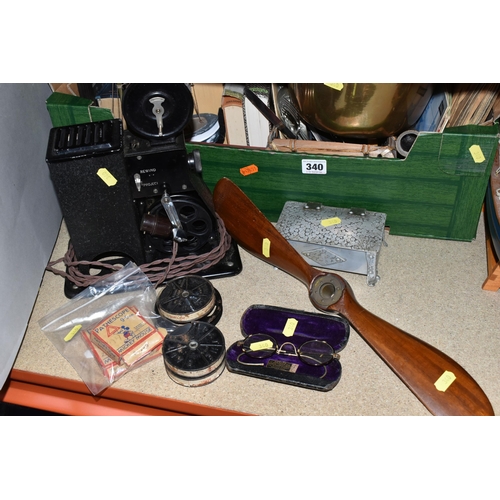 340 - TWO BOXES OF METALWARE AND MISCELLANEOUS ITEMS, to include a small wooden propeller, length 46cm, a ... 