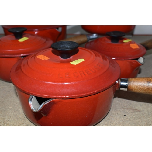 371 - A SET OF FIVE LE CREUSET RED SAUCEPANS, all with lids, comprising  sizes 14,16,18,20,22 (5) (Conditi... 