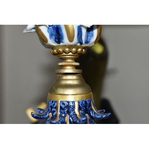 373 - A PAIR OF ITALIAN MANGANI PORCELAIN AND GILT METAL CANDELABRA, five flame, blue and white gilt desig... 