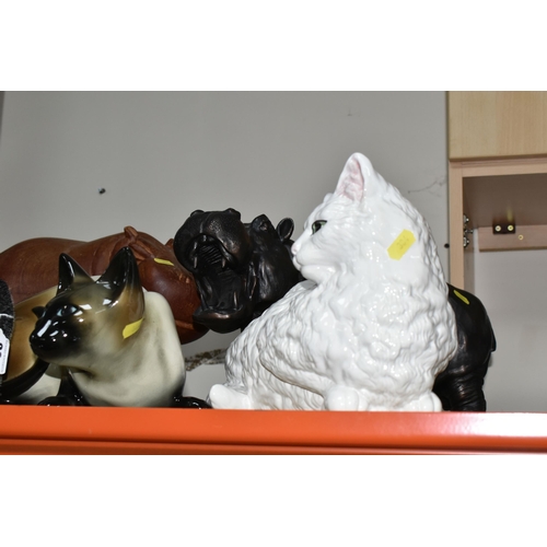 384 - THREE LARGE CAT FIGURINES, comprising a ceramic Siamese cat, a black cat and long haired white cat, ... 