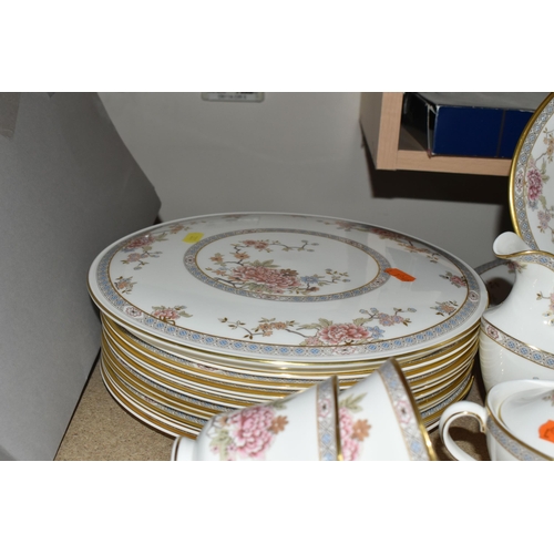 389 - ROYAL DOULTON 'CANTON' PATTERN DINNERWARE, comprising a celebration cake plate, ten dinner plates (n... 