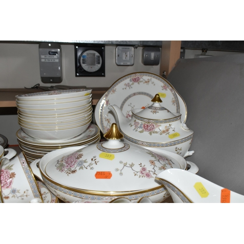 389 - ROYAL DOULTON 'CANTON' PATTERN DINNERWARE, comprising a celebration cake plate, ten dinner plates (n... 