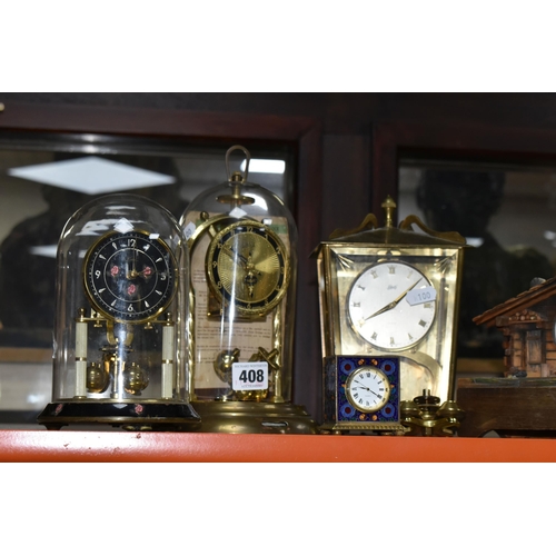 408 - A GROUP OF CLOCKS, to include three Kern and Schatz mid twentieth century anniversary clocks, a cloi... 