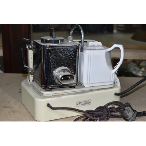 409 - A GOBLIN TEASMADE, model D25, manufactured 1955-1960, the front with circular clock face, orange Gob... 