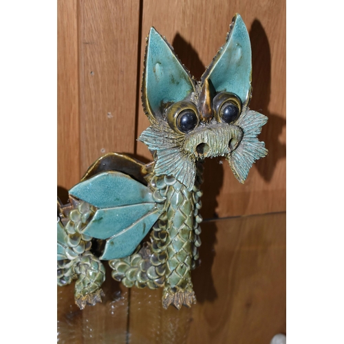 440 - A LARGE YARE DESIGNS ENGLAND POTTERY DRAGON, with paper label to base, height 26cm x length 30cm (1)... 