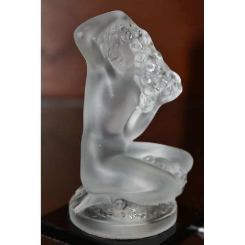 507 - FLOREAL'  LALIQUE,A FROSTED AND OPALESCENT GLASS FIGURE,  of a naked kneeling woman supported by a d... 