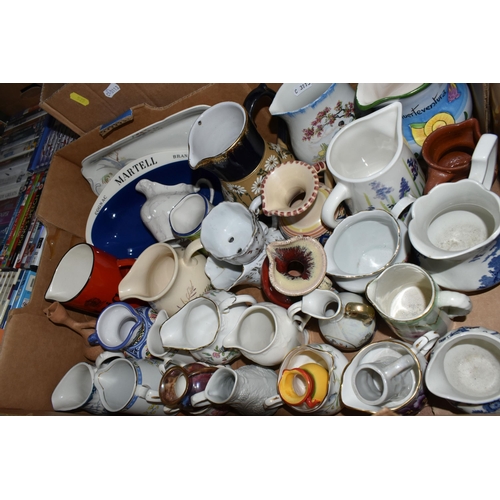 525 - FOUR BOXES OF CERAMICS, DVDS, CDS AND SUNDRY ITEMS, to include a collection of jugs, including a Hai... 