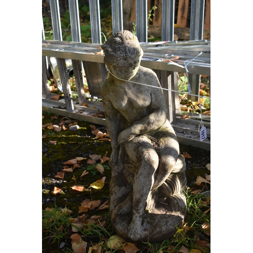 1017 - A COMPOSITE GARDEN FIGURE OF A SCANTILLY CLAD LADY POURING WATER, height 78cm, along with another fi... 