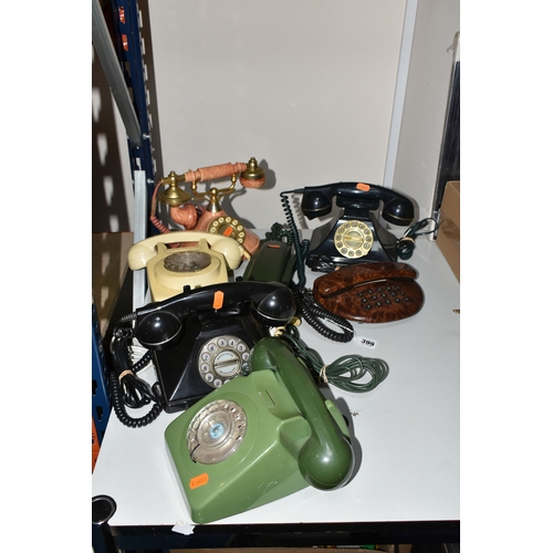 399 - SEVEN LATE TWENTIETH CENTURY TELEPHONES, in various colours and styles, to include two rotary teleph... 