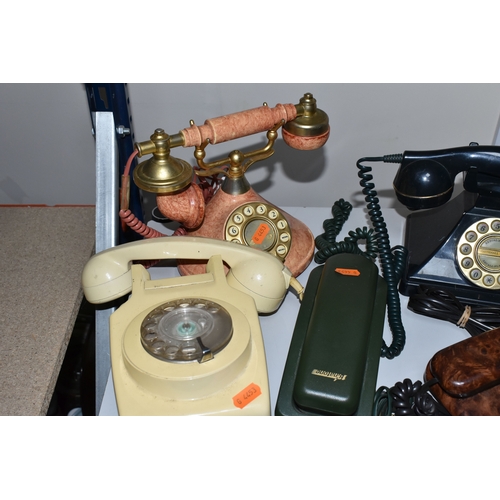 399 - SEVEN LATE TWENTIETH CENTURY TELEPHONES, in various colours and styles, to include two rotary teleph... 