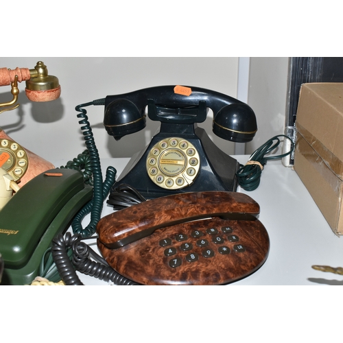 399 - SEVEN LATE TWENTIETH CENTURY TELEPHONES, in various colours and styles, to include two rotary teleph... 