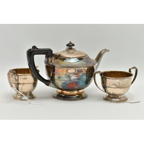 167 - A GEORGE VI SILVER THREE PIECE TEA SERVICE OF CIRCULAR FORM, the tea pot with Bakelite fittings, the... 