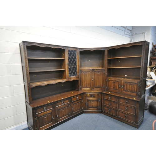 1290 - A JAYCEE OAK LINENFOLD CORNER SHELVING UNIT, with an arrangement of cupboards, shelves, and drawers,... 