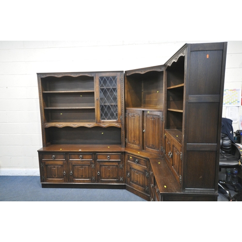 1290 - A JAYCEE OAK LINENFOLD CORNER SHELVING UNIT, with an arrangement of cupboards, shelves, and drawers,... 