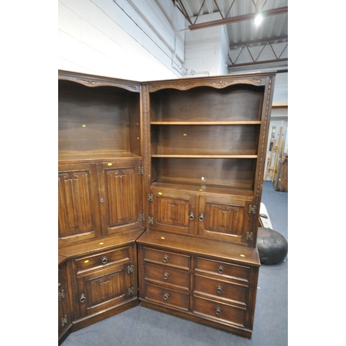 1290 - A JAYCEE OAK LINENFOLD CORNER SHELVING UNIT, with an arrangement of cupboards, shelves, and drawers,... 