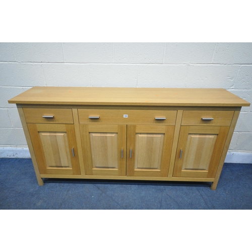 1291 - A G PLAN SOLID OAK SIDEBOARD, with three drawers, over four fielded panel doors, width 176cm x depth... 