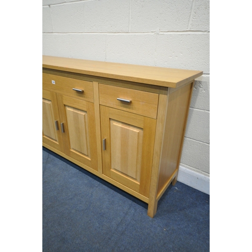 1291 - A G PLAN SOLID OAK SIDEBOARD, with three drawers, over four fielded panel doors, width 176cm x depth... 