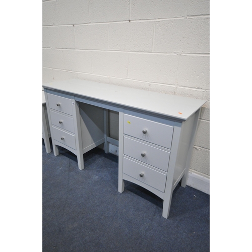 1293 - A MARKS AND SPENCERS GREY BEDROOM SUITE, comprising a dressing table with six drawers, width 137cm x... 