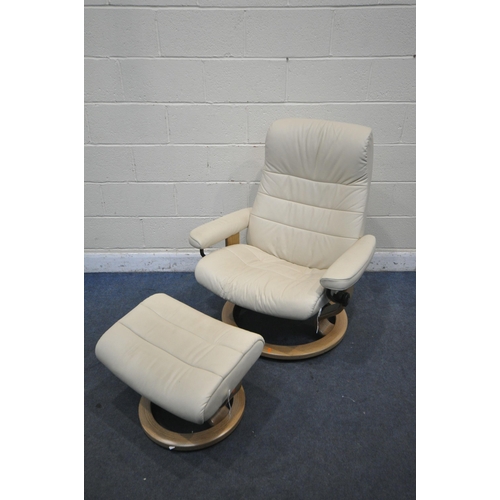 1299 - AN EKORNES STRESSLESS CREAM LEATHER RECLINING SWIVEL ARMCHAIR, with footstool (condition report: goo... 