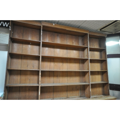 1302 - A LARGE 19TH CENTURY OAK BOOKCASE, the top breakfront section fitted with four astragal glazed doors... 